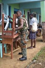 A member of the VMF team assisting with maintenance at a school in Pentecost.